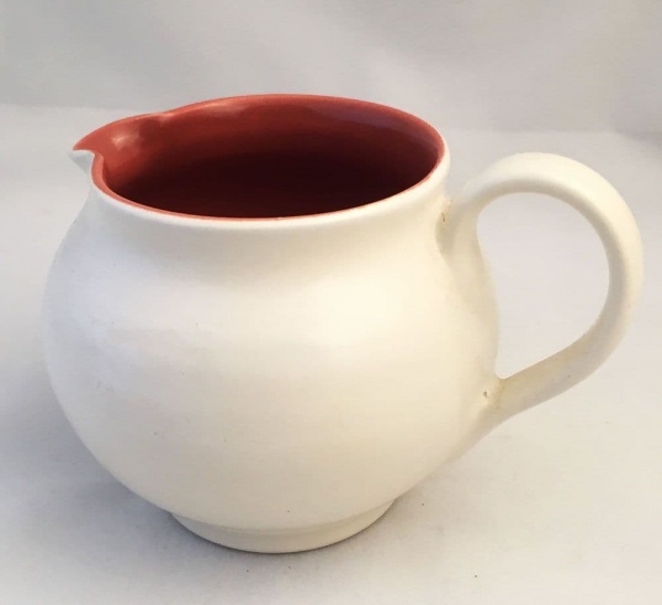 Poole Pottery, Twintone, Red Indian and Magnolia (C95) Cream Jug